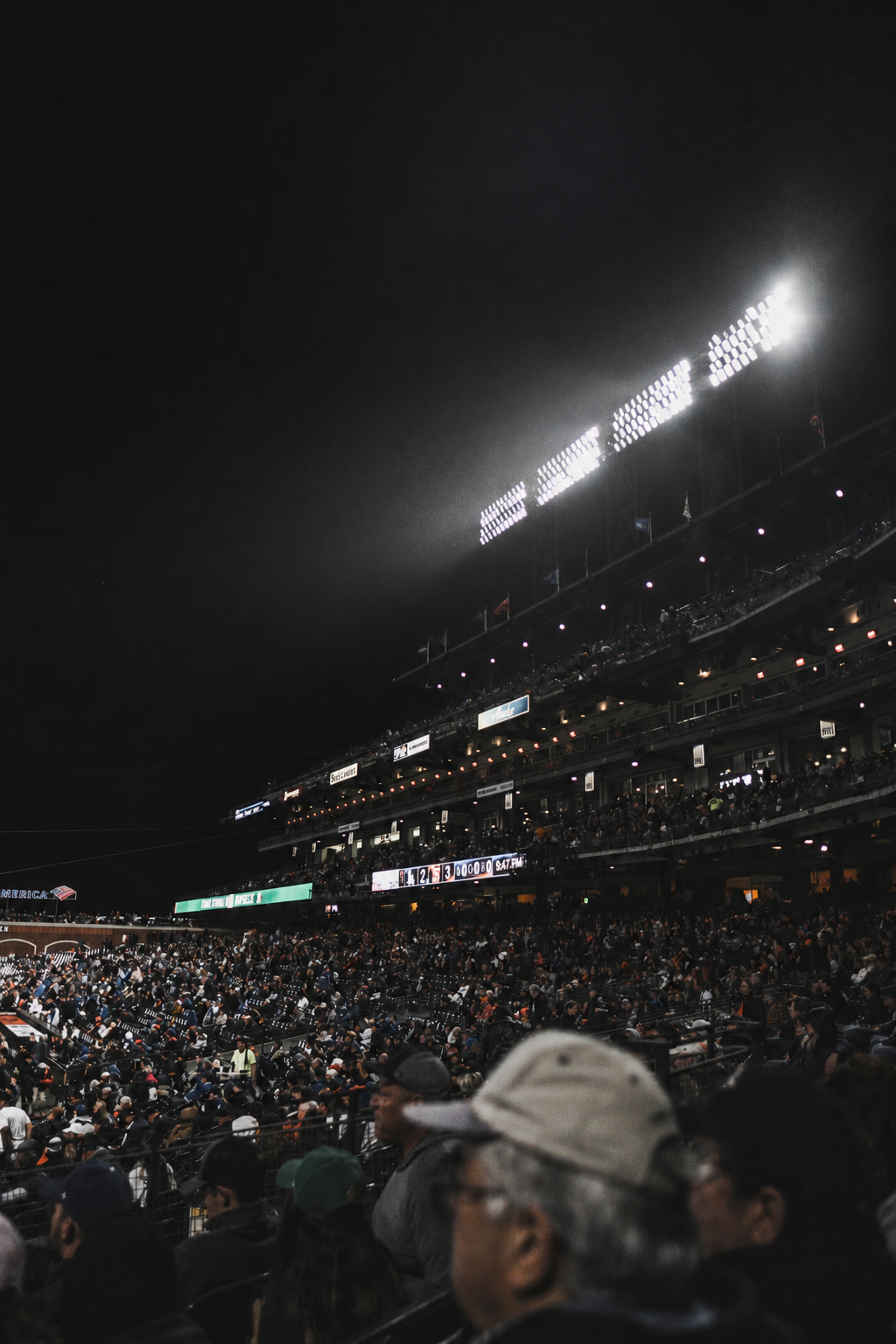 Night baseball stadium with sponsor lettering retouched